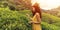 Traveler Woman With Tea Leaf in Hand During Her Travel to Famous Nature Landmark Tea Plantations in Sri Lanka