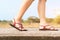 Traveler young women on sneakers shoe walking on the bridge on sunny day