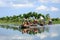 Travelers on boats to visit rice fields on river