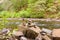 Travelers cairns at a shallow river in northern canada