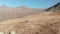 Travelers girls make photo on mountain landscape while backpacking hike. Aerial shooting tourist people posing and