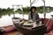 Travelers guest women sit and eat thai local food fusion modern luxury style set for serve dinner meal at dining terrace outdoor