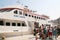 Travelers of King Saron passenger catamaran come ashore in the port of Symi, Symi island, Greece