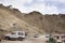 Travelers people and driver stop car in parking at Leh Stok Palace at Leh Ladakh Village winter season in Jammu and Kashmir, India