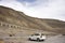 Travelers people and driver stop car in parking at outdoor of viewpoint Confluence of the Indus and Zanskar Rivers while winter