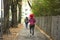 Travelers people walking at footpath beside road in small alley