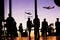 Travelers silhouettes at airport