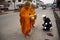 Travelers thai women travel visit and respect praying put food and things offerings to monks on the road front of local market