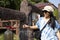 Travelers thai women travel visit and rite ritual knock metal bell for respect pray god angel buddha at Wat Roi Phra Phutthabat