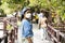 Travelers thai women travel visit and walk posing portrait on stone bridge of time travel journey zone in sea ocean of Mu Ko Petra