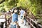 Travelers thai women travel visit and walk posing portrait on stone bridge of time travel journey zone in sea ocean of Mu Ko Petra