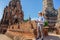 Travelers traveling to Asia. Eastern Asia summer holidays. Caucasian man tourist looking at Wat Chaiwatthanaram temple. Tourist