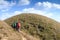 Travelers trekking with scenic mountains view in the morning sunrise from Mon Chong