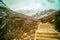 Travelers walking with snow capped mountain background to Milk Lake and Five colors lake in Yading Nature Reserve