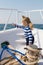 Traveling adventures and wanderlust. funny kid in striped marine shirt. happy little boy on yacht. boat trip by sea