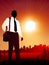 Traveling Businessman on sunset background