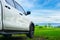 Traveling by car. Freedom car travel in holiday background concept with green nature and bright blue sky. Travel with pickup car