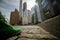 Traveling concept. Green boot close up with blurred new york city on background