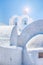 Traveling Concepts. View of Traditional Greek Round Houses of Oia or Ia at Santorini Island in Greece With Cross and Bells.