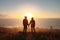 Traveling couple on cliff at sunset