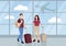 Traveling couple with their luggage in airport