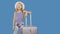 Traveling girl with suitcase greeting and gesturing hello on blue background in studio. Girl teenager with suitcase