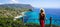 Traveling in Italy. Panoramic view of elegant woman with hat in Capo Vaticano in the Coast of the Gods, Calabria, Italy