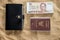 Traveling items: Thailand passport, wallet and Thai money
