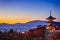 Traveling Through Japan. Amazing Vivid Sunset Over Kiyomizu-dera Temple Pagoda With Kyoto City Skyline in Background in Japan