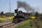 Traveling between Leshan City, Sichuan Qianwei Ka Yan Yang train bees to the small train station canola flower