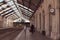 traveling man crossing paths with woman and exchanging glances at the disused train station in the city of Barreiro