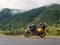 Traveling motorcycle with foggy green mountain background