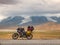 Traveling motorcycle with luggage in stormy weather