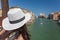 Traveling. Tourist in hat watching Grand Canal
