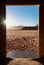 Traveling in Wadi Rum desert, Jordan. Door frame with desert view in sunrise
