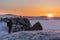 Traveling in winter at lake Baikal in Irkutsk, Russia. Winter landscape in sunset with young photographer enjoying beautiful suns