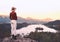 Traveling young woman looking at Bled Lake, Slovenia, Europe