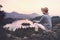 Traveling young woman looking at Bled Lake, Slovenia, Europe