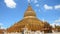 Traveller and Burmese people come to Shwezigon Pagoda at Bagan in Mandalay, Myanmar