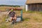 Traveller drinking water at country draw-well