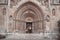 Traveller free woman in front of The Chapel of Jak in Vajdahunyad Castle in the City Park in Budapest, Hungary.