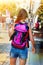 Traveller girls with back view close up violet female backpack
