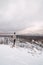 Traveller looks around the snowy landscape. Winter walk through untouched landscape in Beskydy mountains, Czech Republic. Hiking