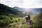 Traveller man with backpack sitting on rock at outdoor,Meditations to calm your mind and body