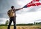 Traveller man holding american usa flag outdoor with storm cloud