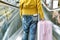 Traveller standing with a luggage at airport terminal.