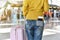 Traveller standing with a luggage at airport terminal, Passenger walking to departure check-in counter.