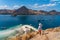 A traveller standing on top of Kelor island in Flores island Komodo national park, Indonesia