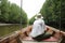 Traveller thai woman sit on service long tail boat for looking a