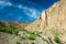 Traveller on the trekking on Markha valley trek route in Ladakh, Karakorum panorama. This region is a purpose of motorcycle